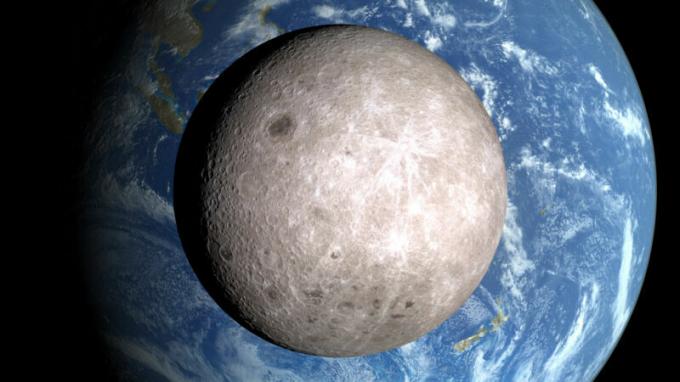 Изображение Луны в космосе, когда она вращается вокруг Земли.